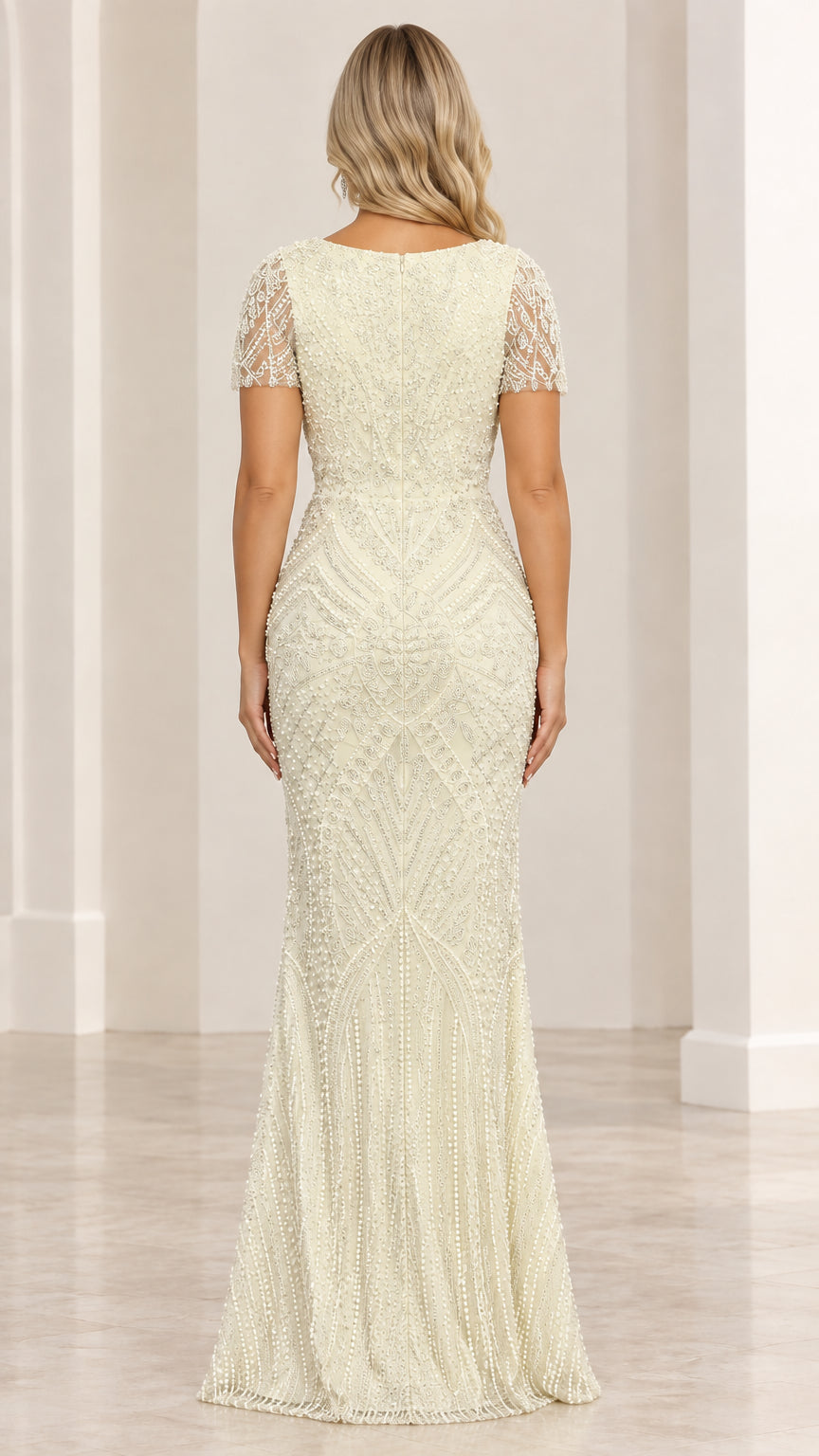Back view of pale yellow beaded floor-length evening dress