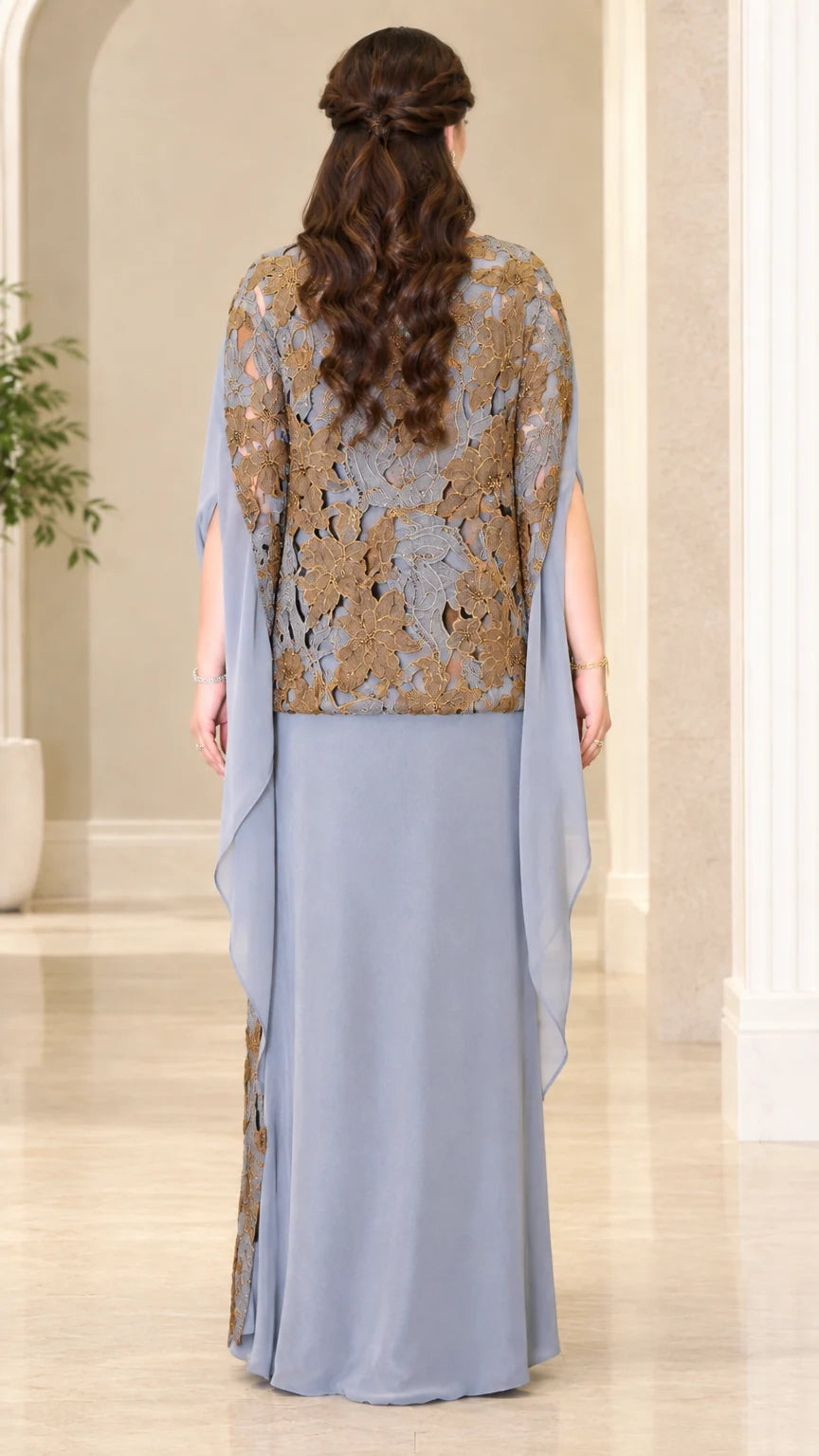 Back view of dusty blue evening maxi gown showing flowing cape detail
