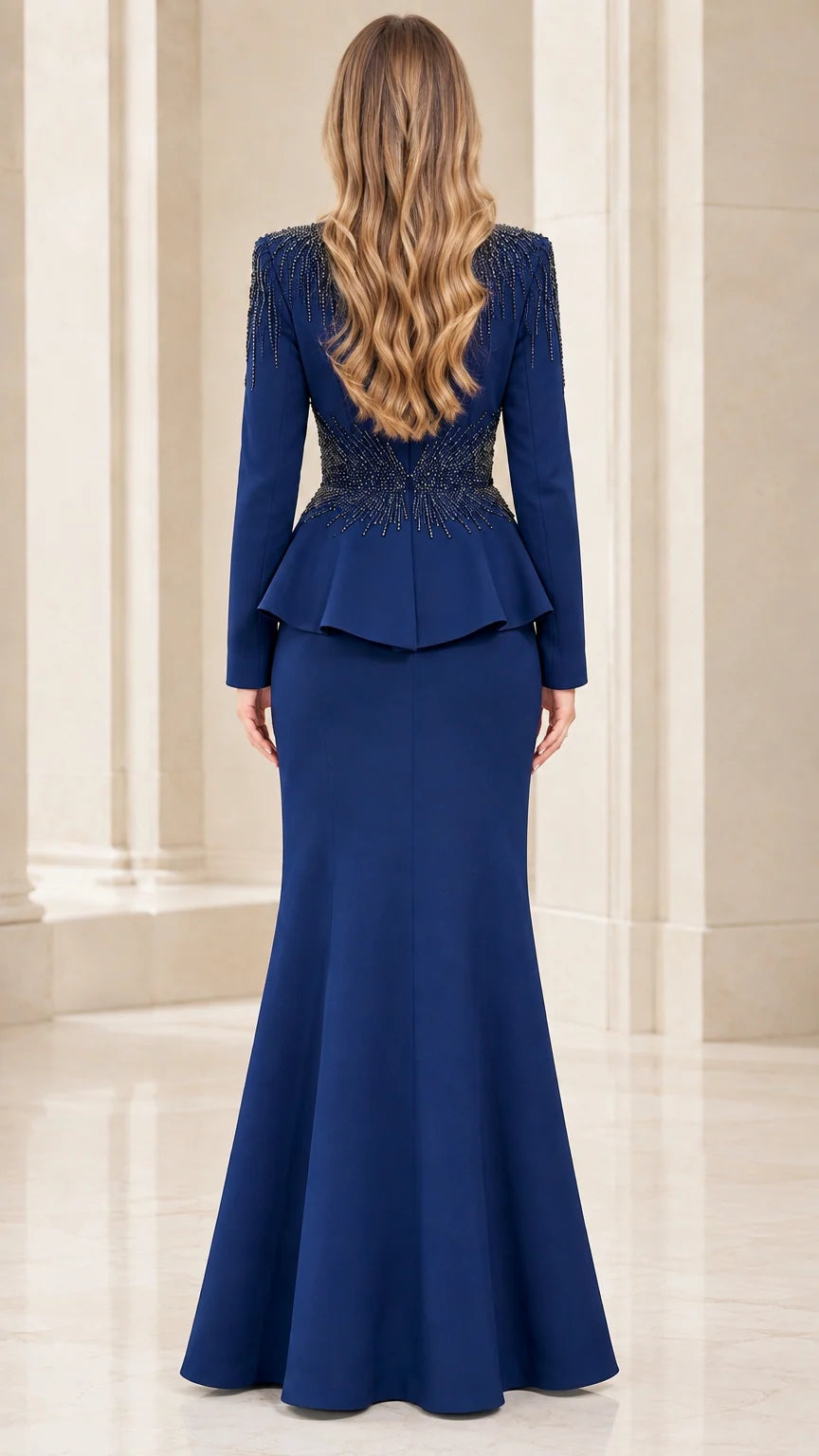 Back view of royal blue beaded evening gown showing peplum and flared hem