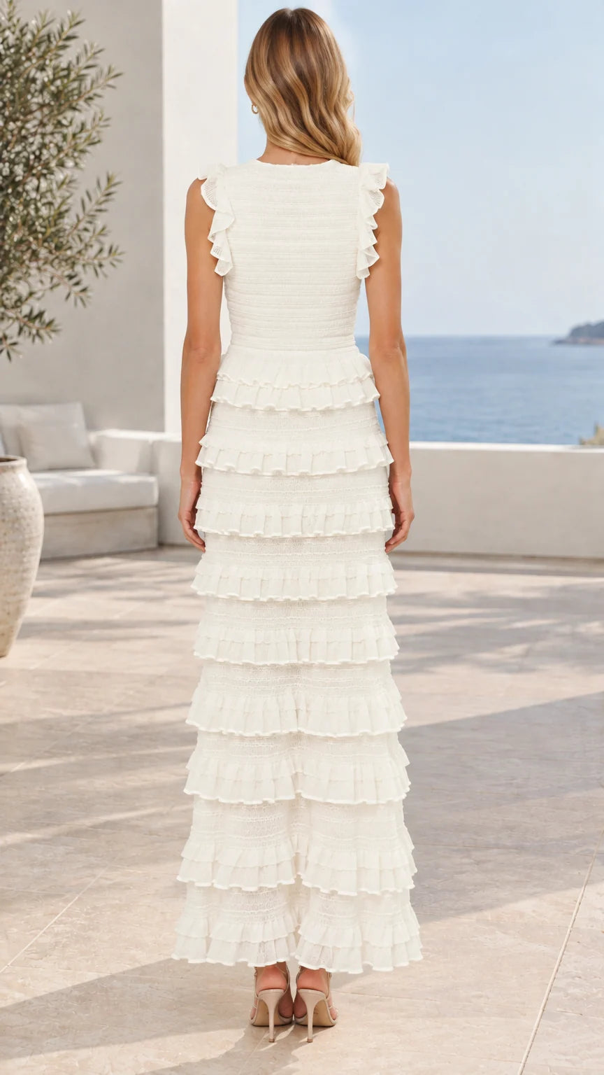 Back view of model wearing white sleeveless tiered ruffle maxi dress