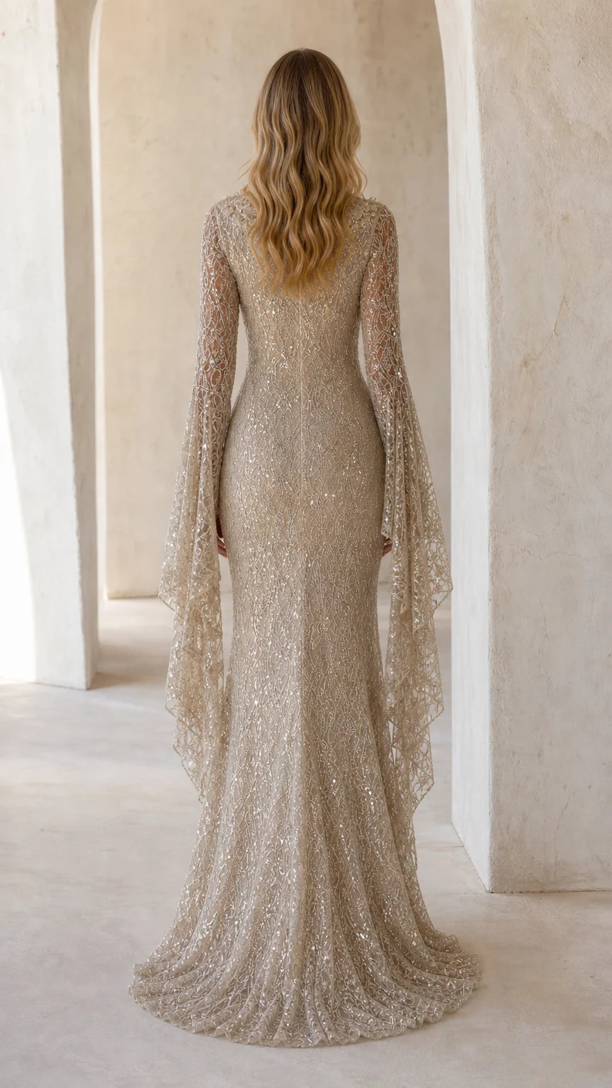 Back view of champagne sequin formal dress with elegant mermaid puddle train