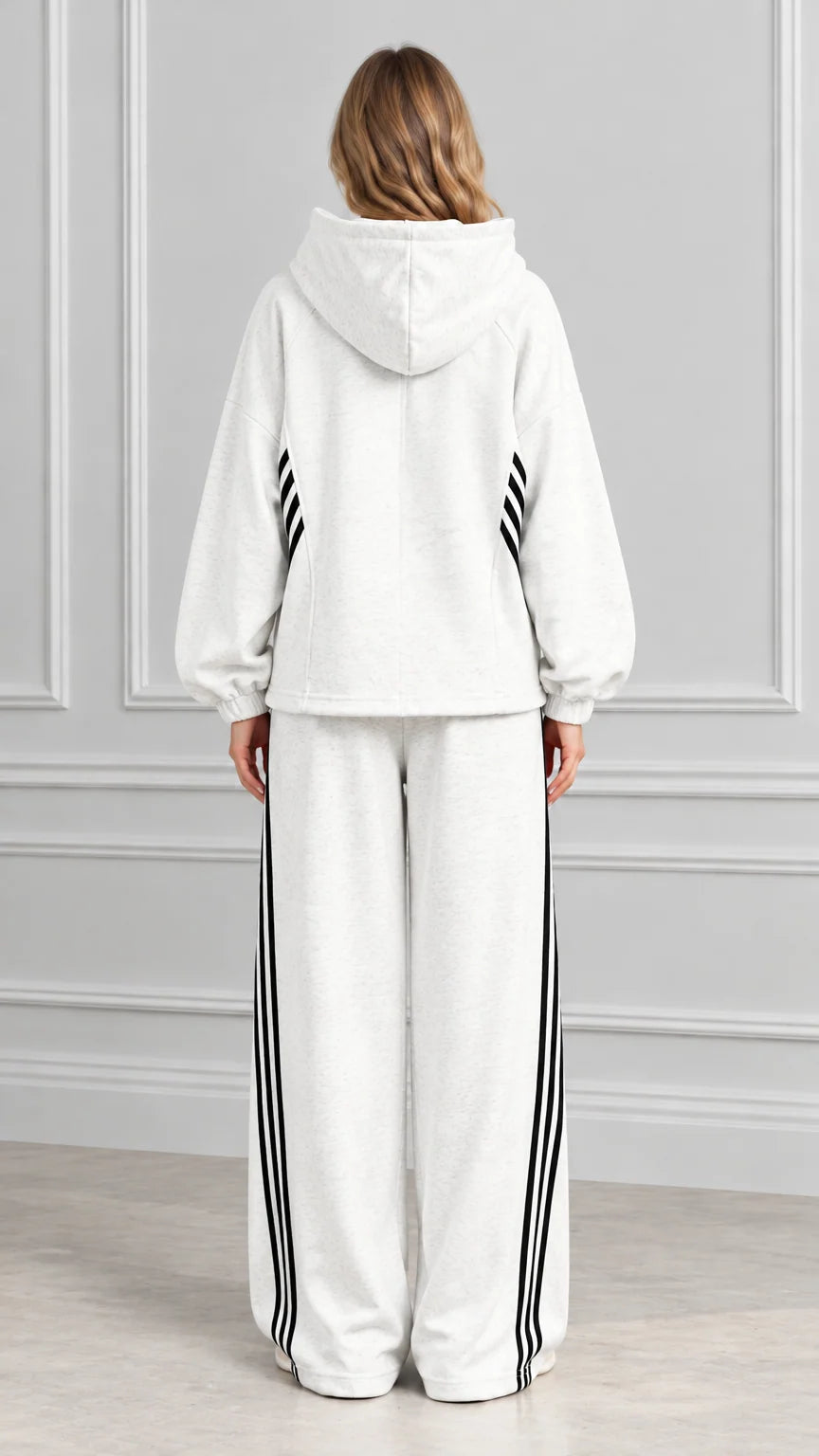 Back view of woman wearing Heather Gray hooded sweatshirt and wide-leg lounge pants