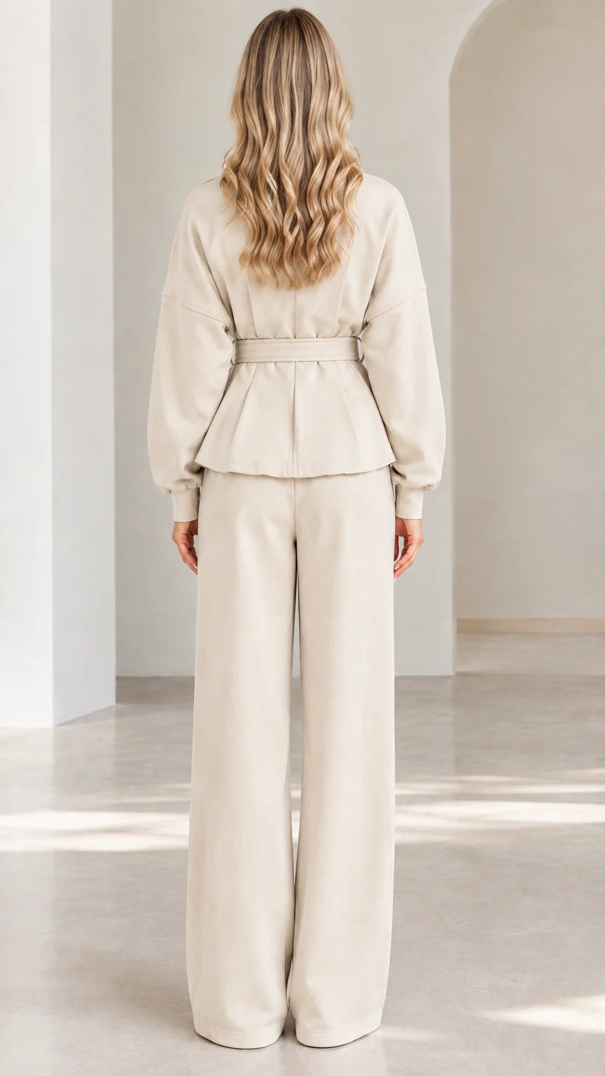 Back full-length view of beige two-piece peplum and wide-leg pants set