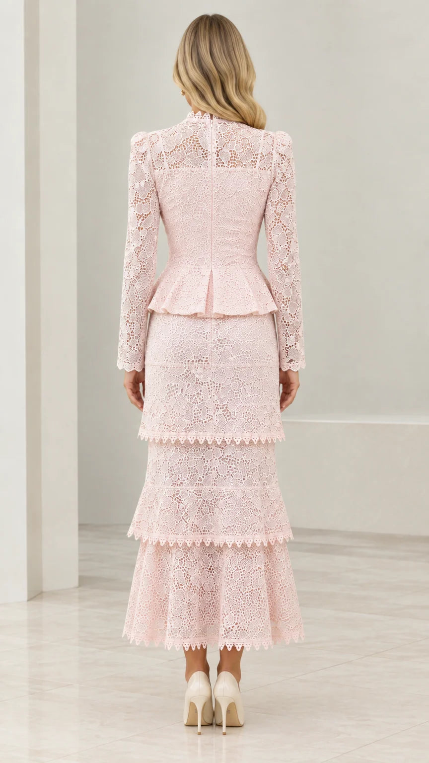 Back view of model wearing Blush Pink tiered lace evening set