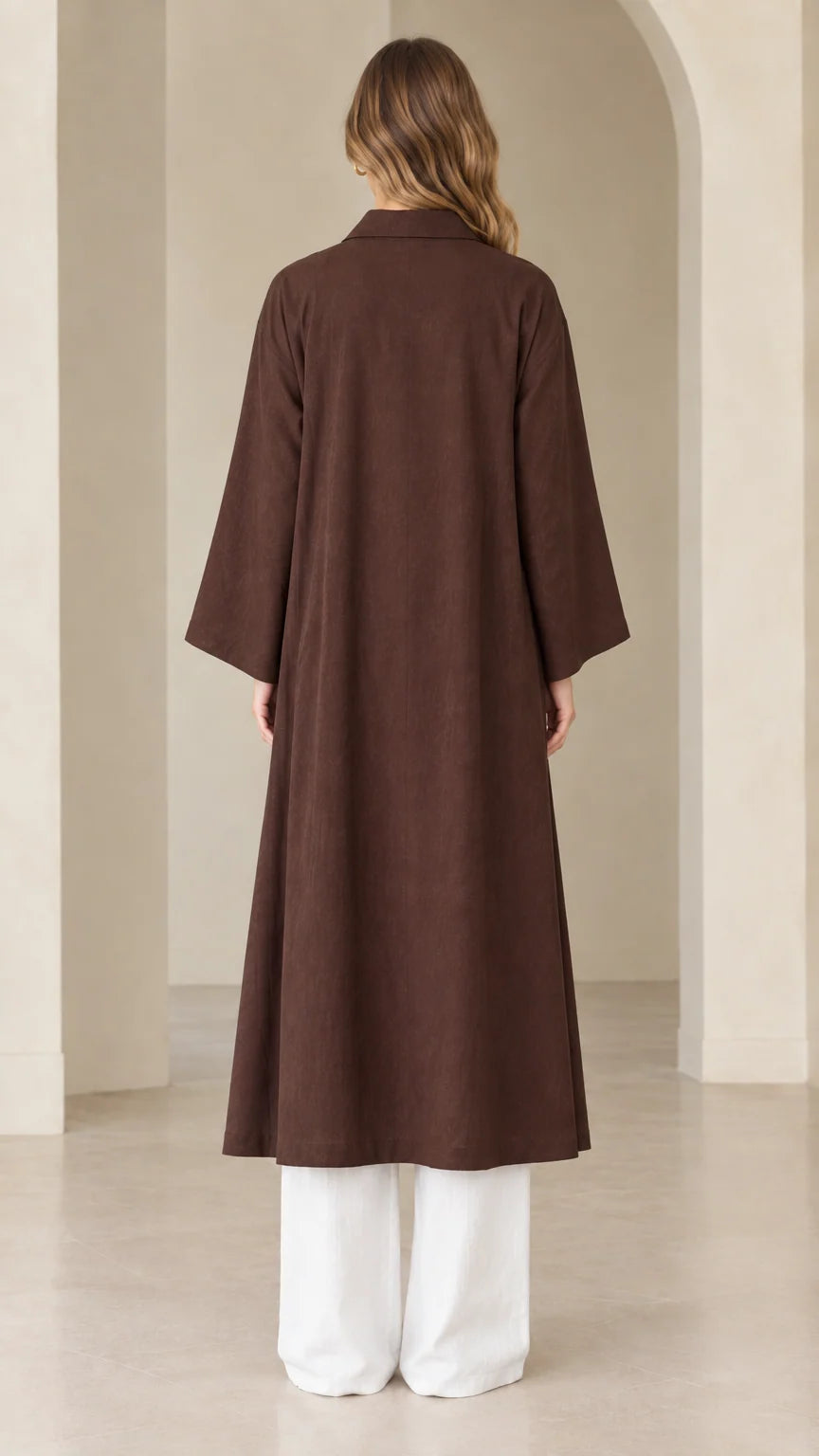 Back view of model wearing full-length dark brown open front duster coat