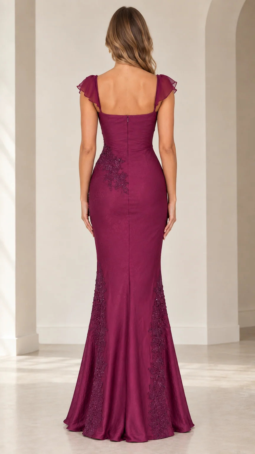 Back view of woman wearing magenta mermaid evening dress with square back and delicate flutter sleeves