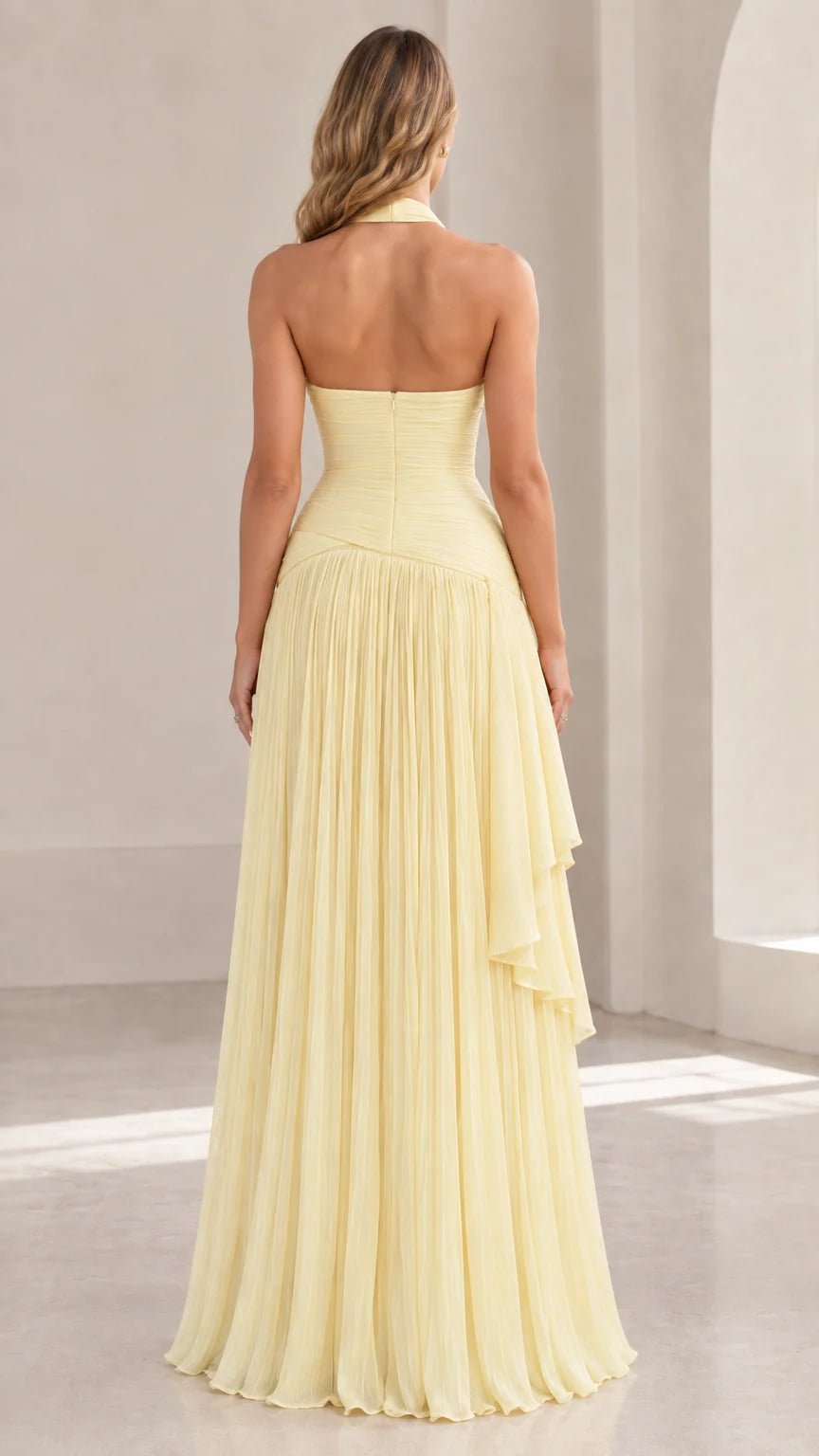 Back view of Butter Yellow open-back halter evening dress showing zip closure