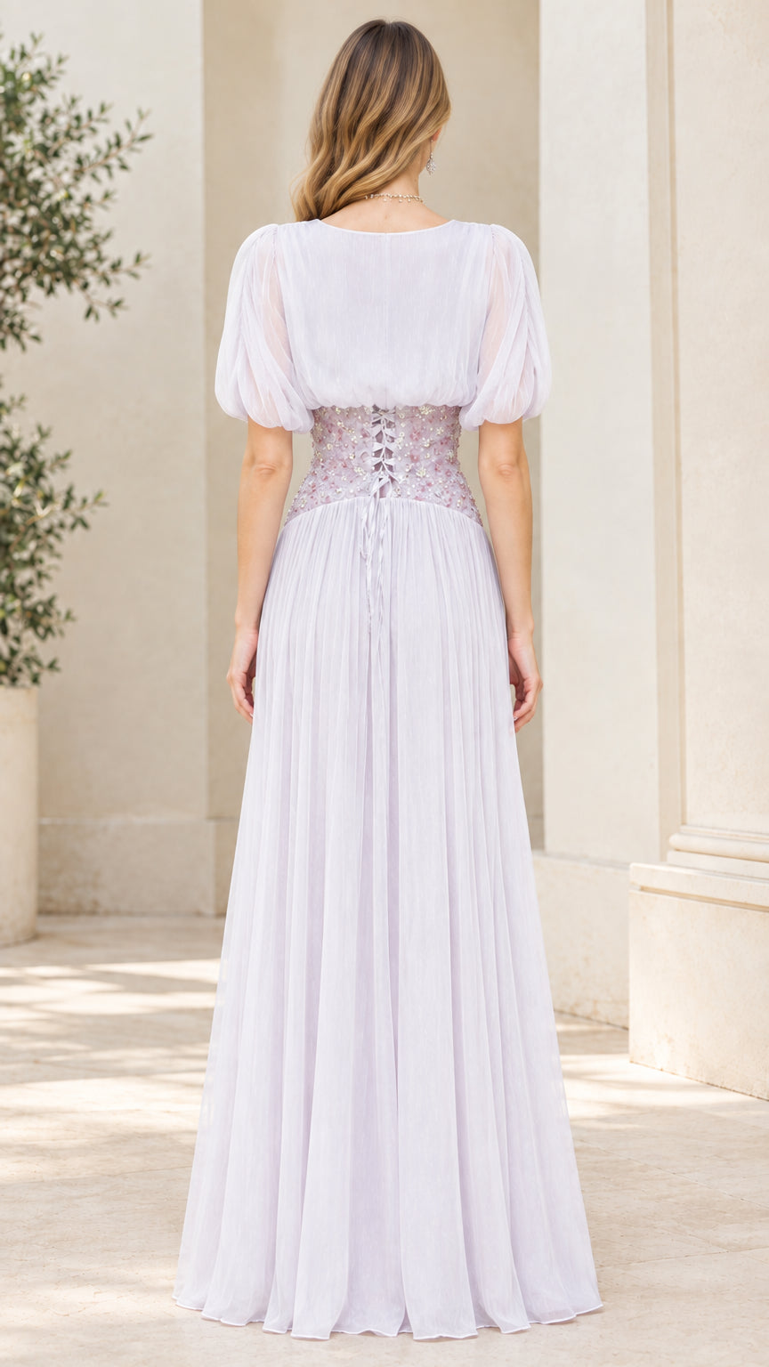 Back view of lavender chiffon maxi dress featuring corset lace-up waist detail