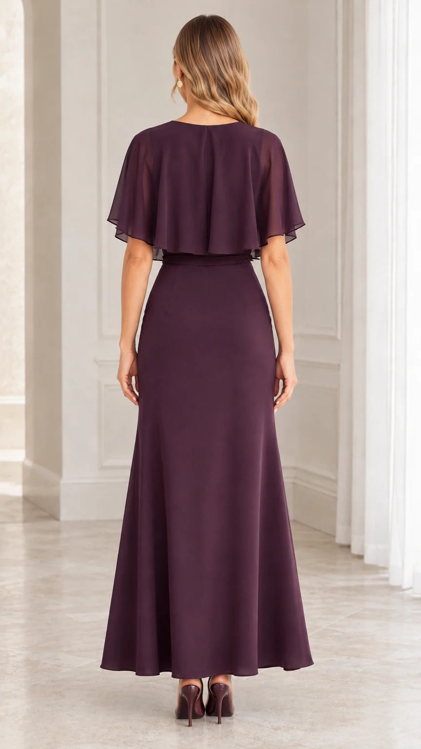 Back view of plum chiffon maxi dress showing the flutter capelet overlay