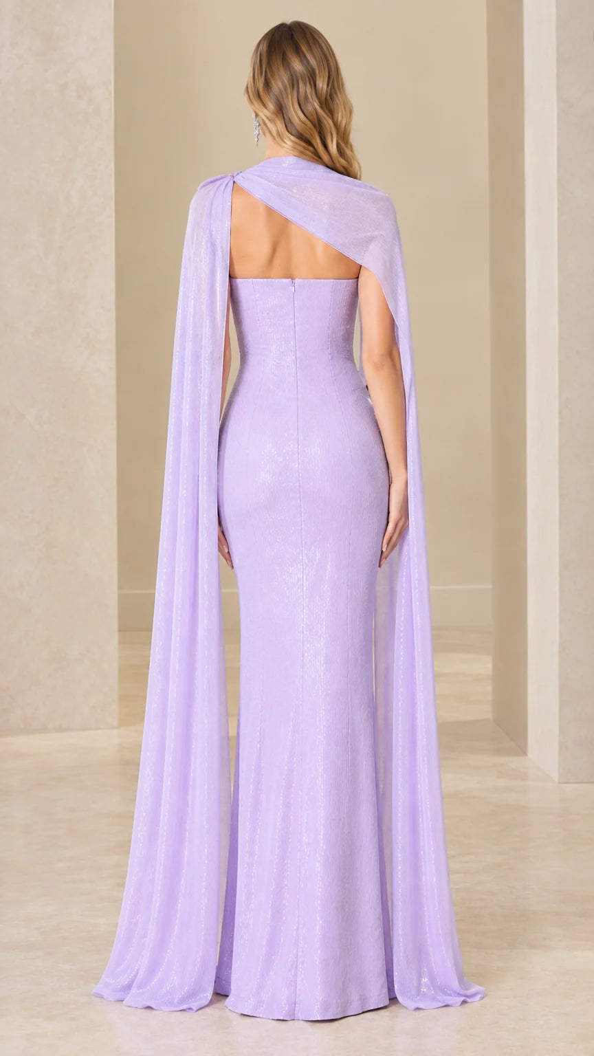 Back view of lavender evening dress showing asymmetrical cape draping