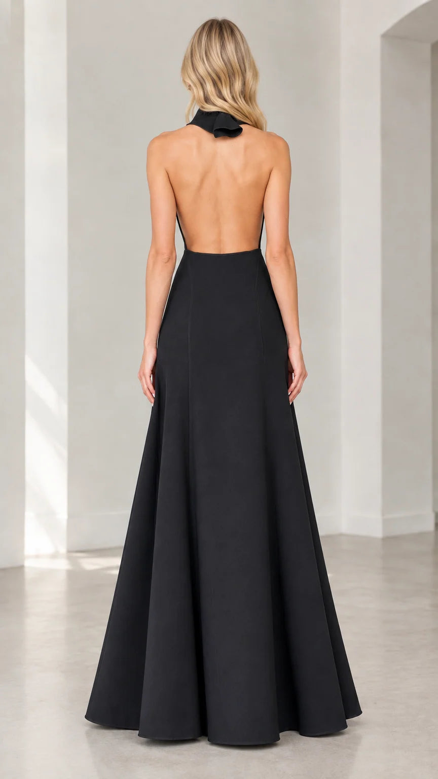 Back view of black halter gown showcasing open back design