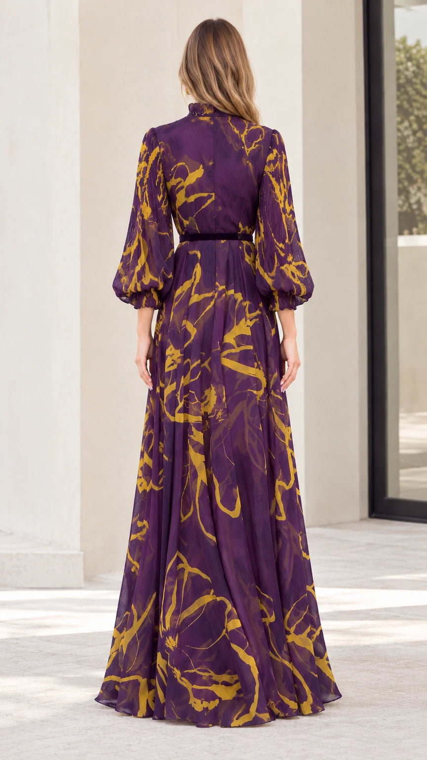 Back view of model wearing purple abstract print maxi dress with high neck