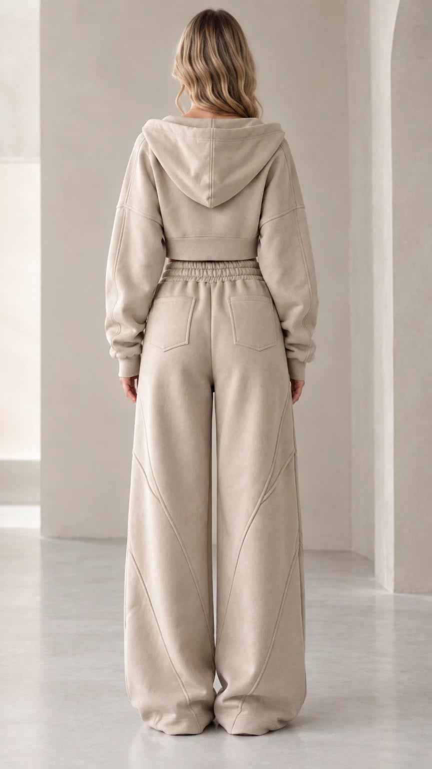 Back view of model in oatmeal cropped hoodie and wide-leg sweatpants