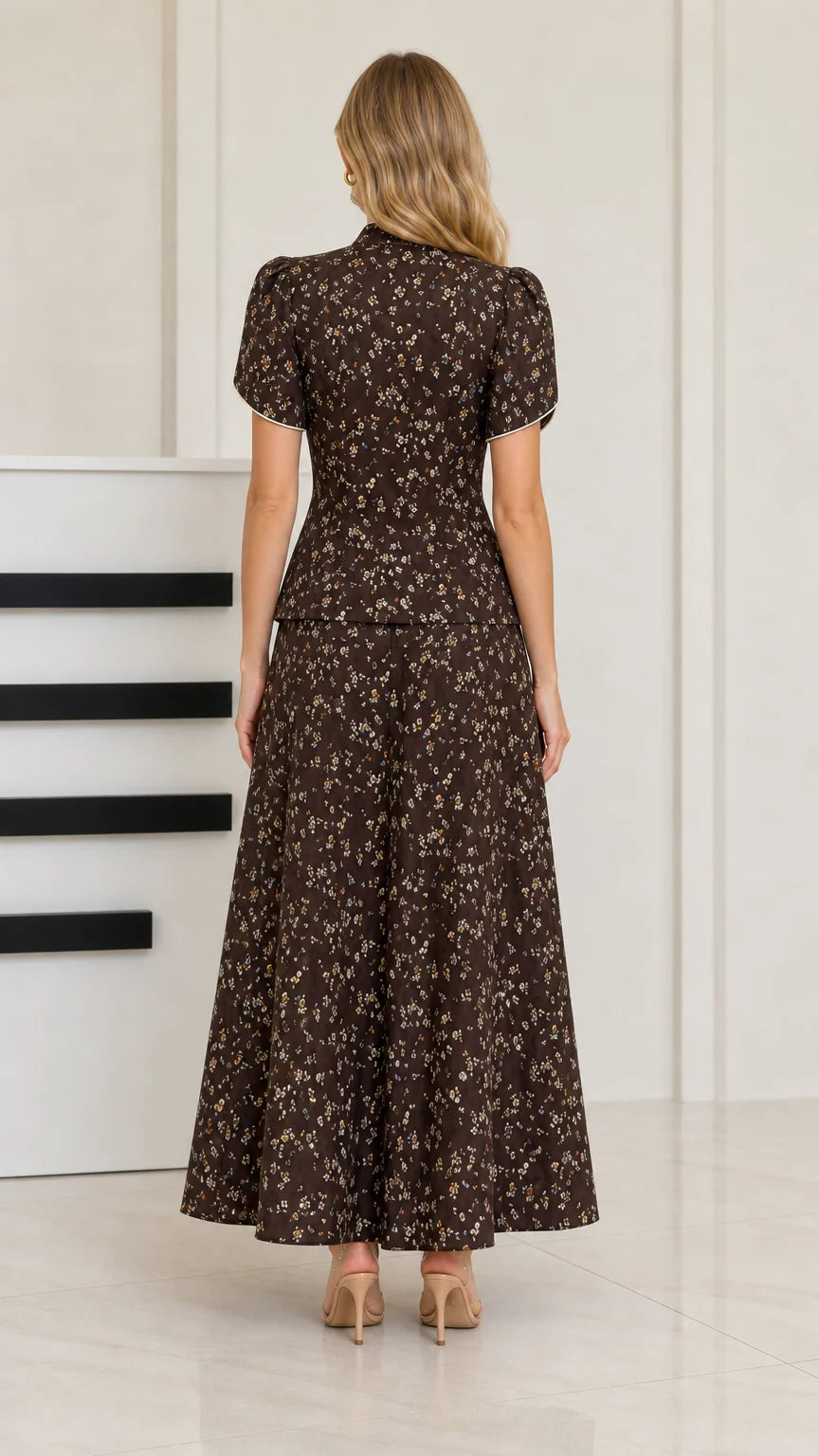 Back view of woman wearing dark brown floral maxi skirt and top set