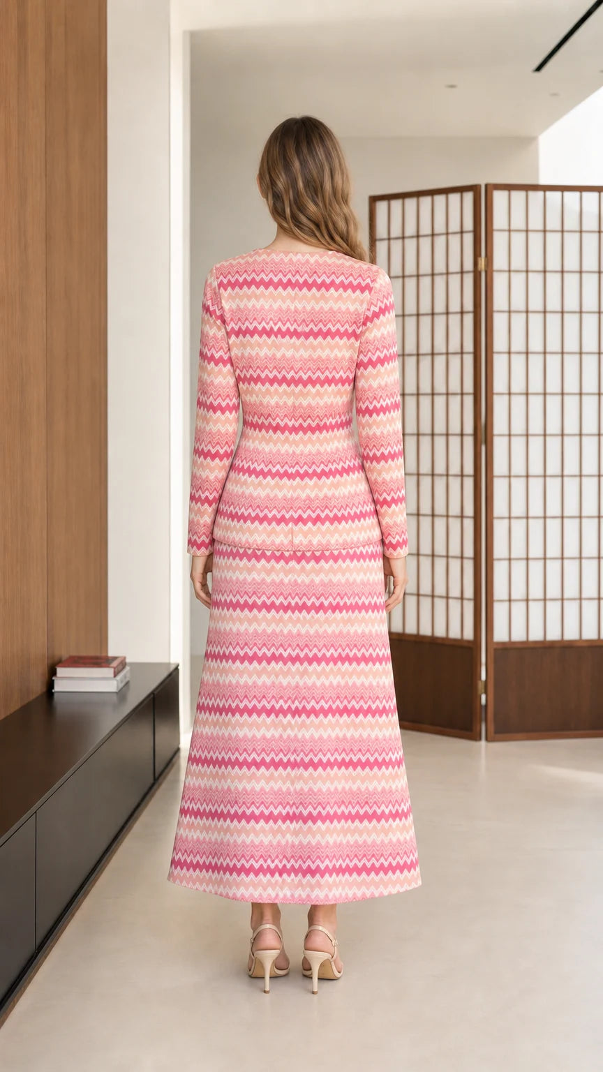 Back view of model wearing pink chevron knit long sleeve top and maxi skirt