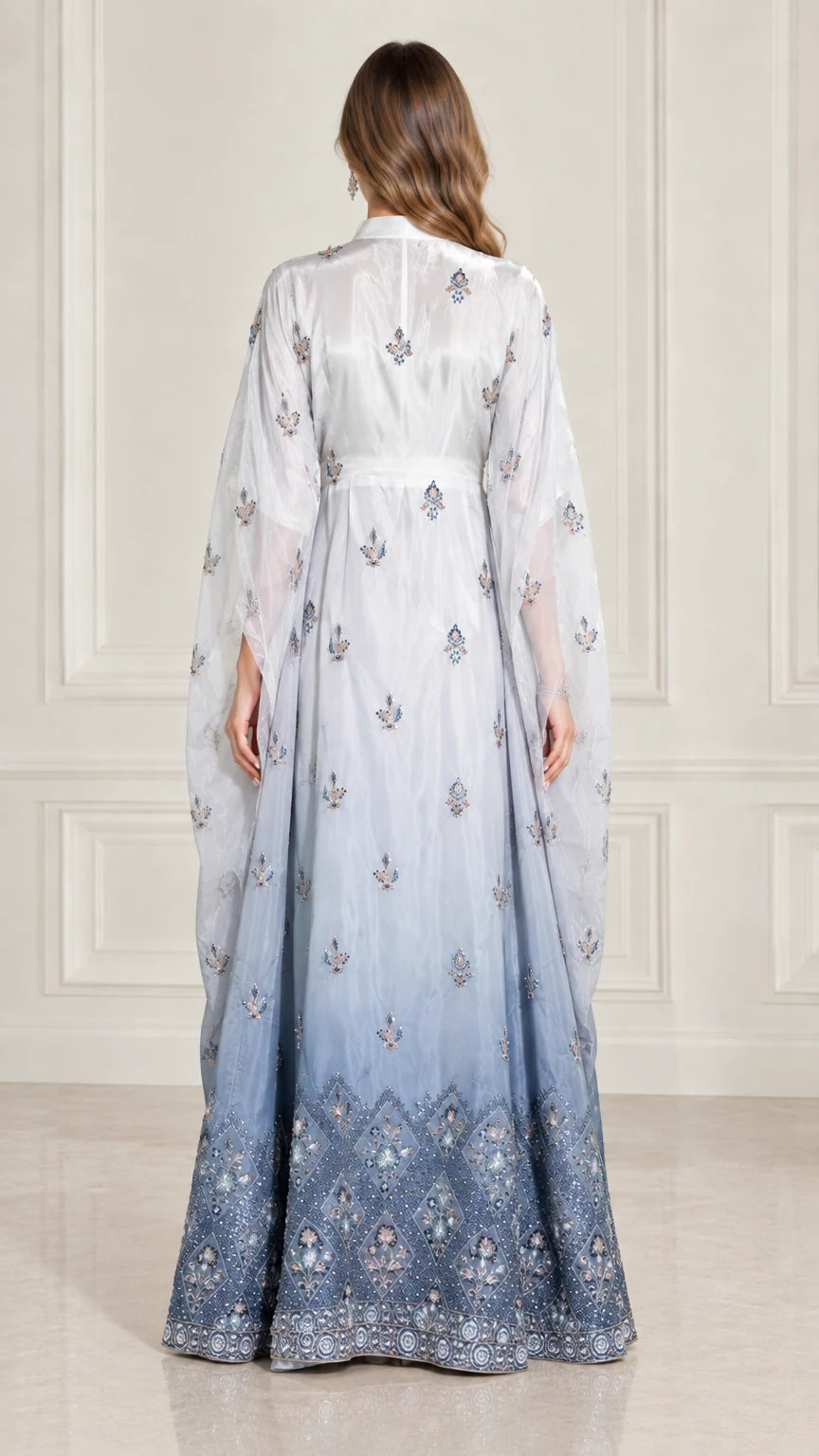 Back view of model in Ice Blue draped cape sleeve formal kaftan