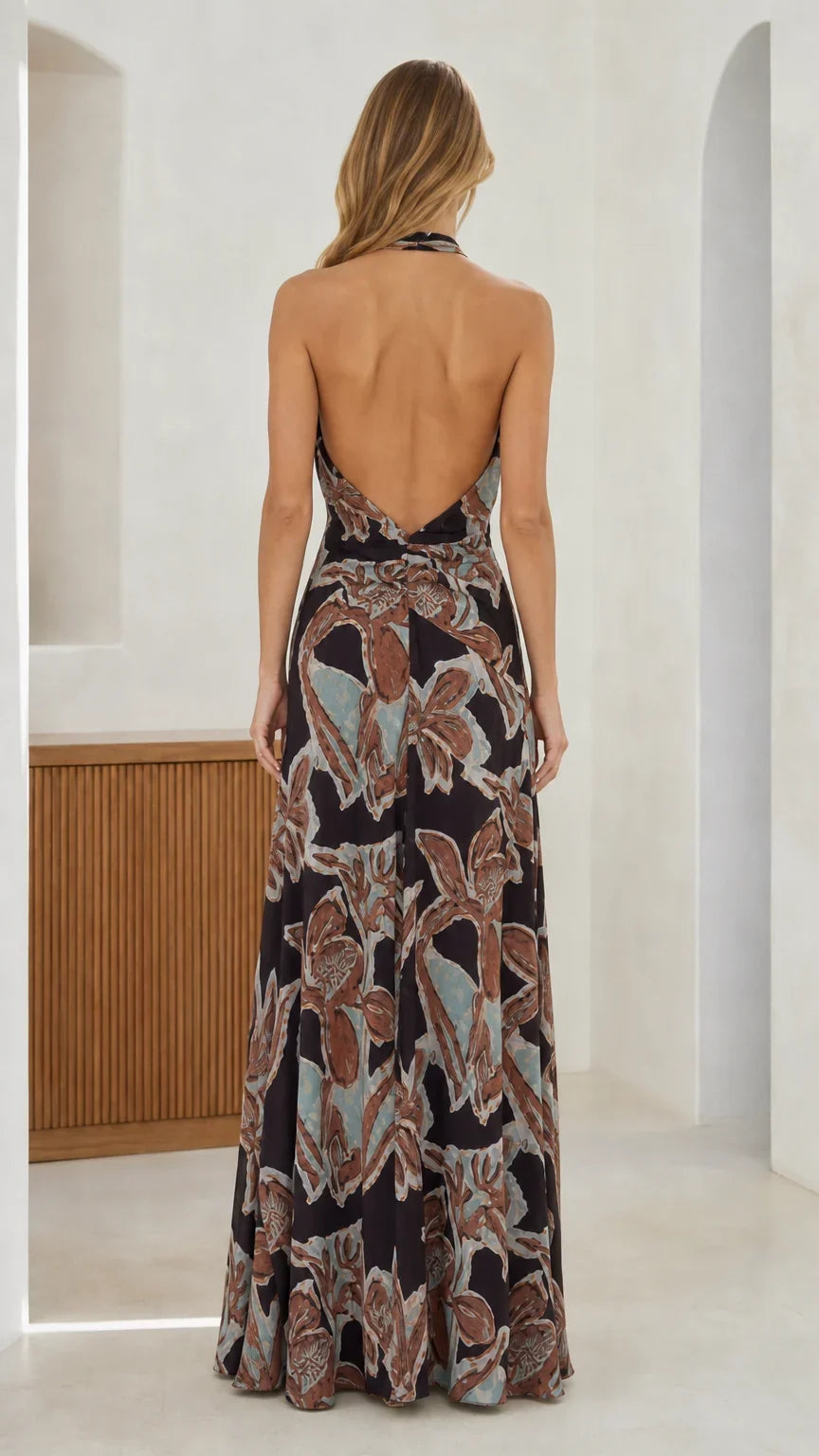 Back view showcasing open back design of the black maxi dress