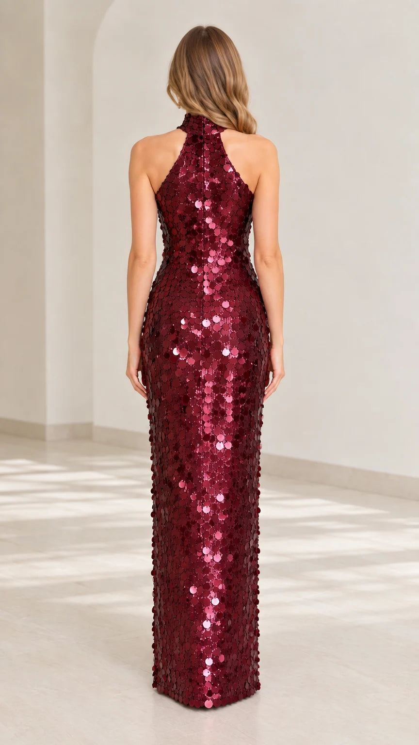 Back view of model wearing burgundy sequin halter maxi dress