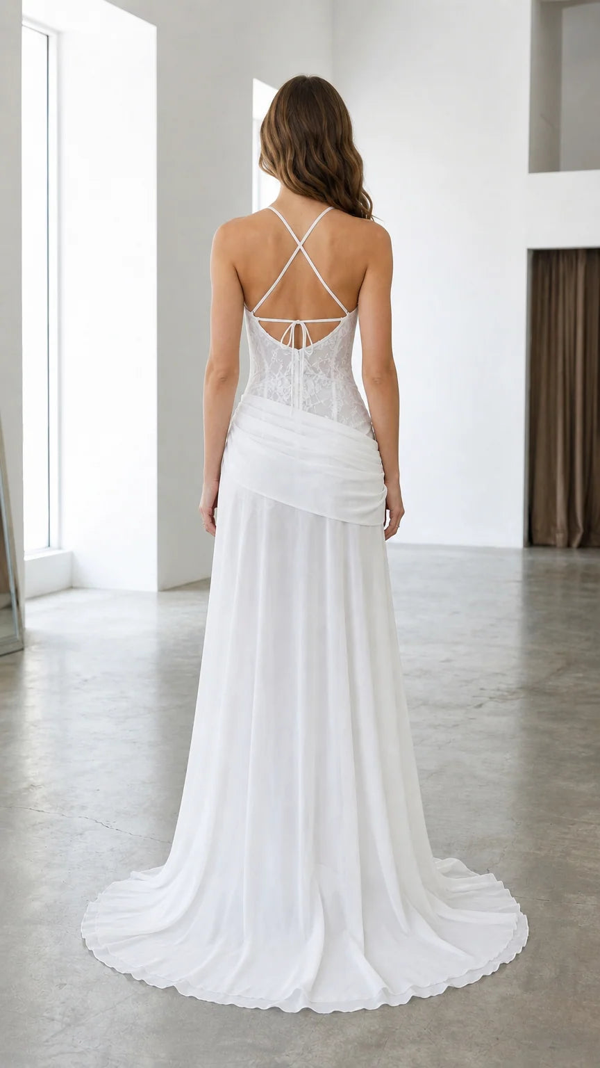 Back view of white lace formal gown showing crisscross strap back detail