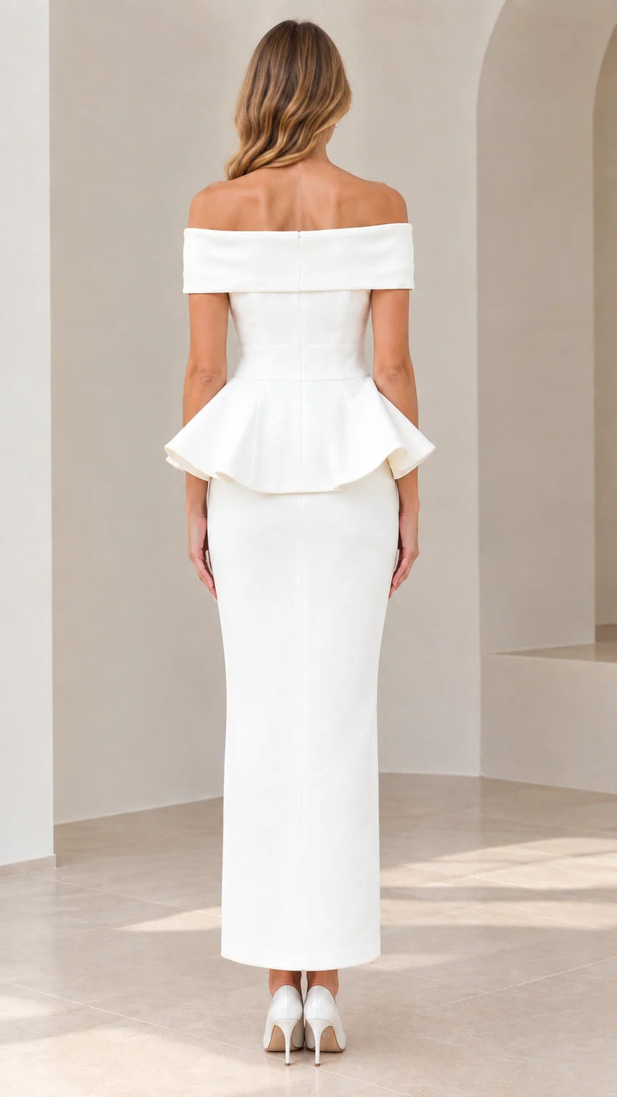 Back view of model showing tailored fit and peplum detail on white maxi dress