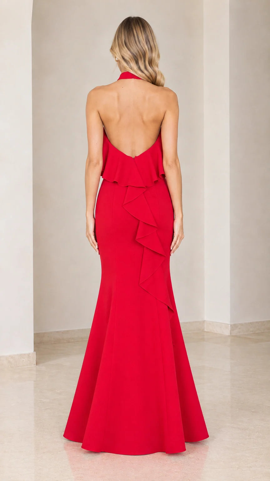 Back view of red maxi dress showing open back and cascading ruffle detail
