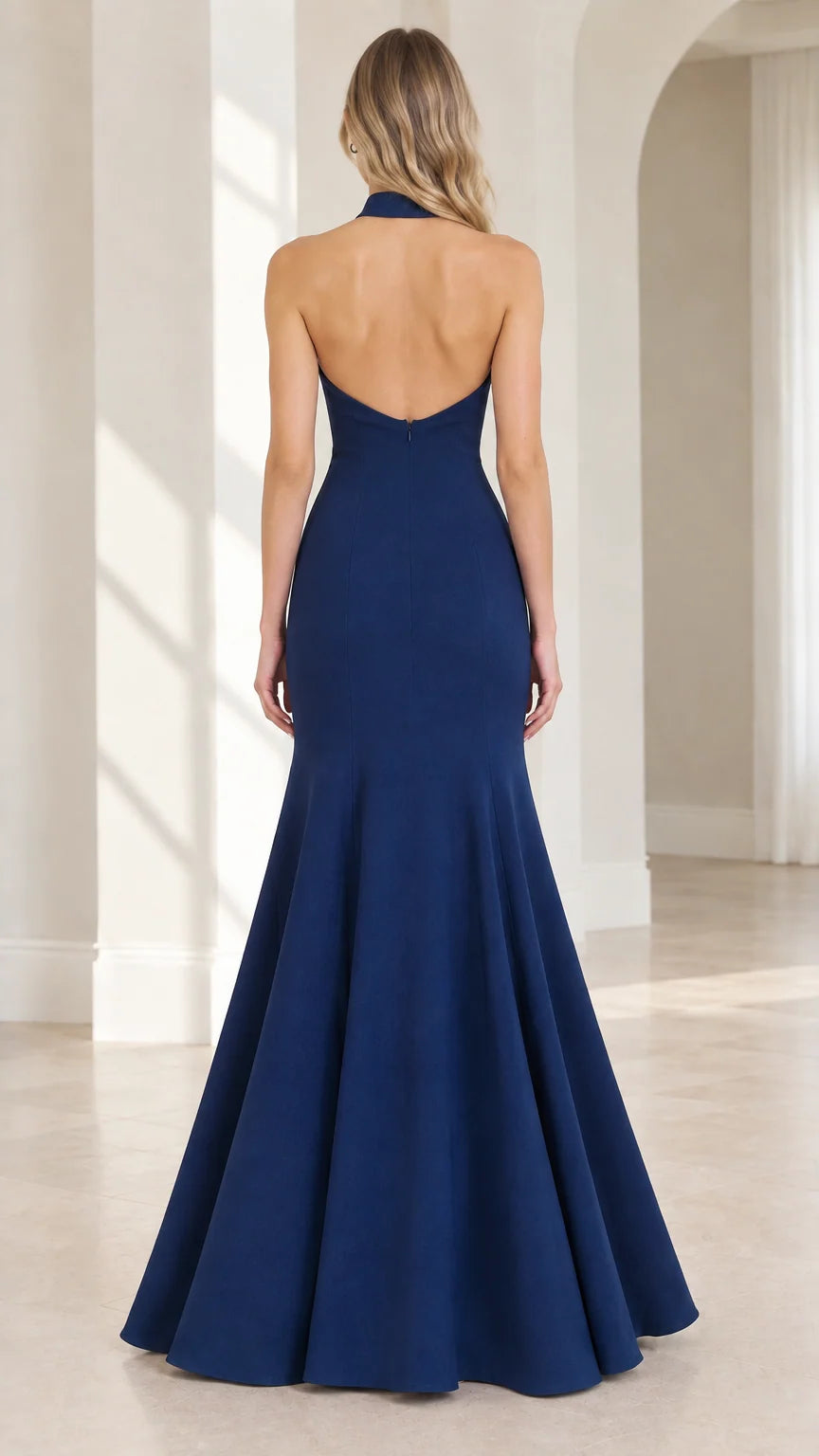 Back view of model showing open back design on Navy Blue formal gown