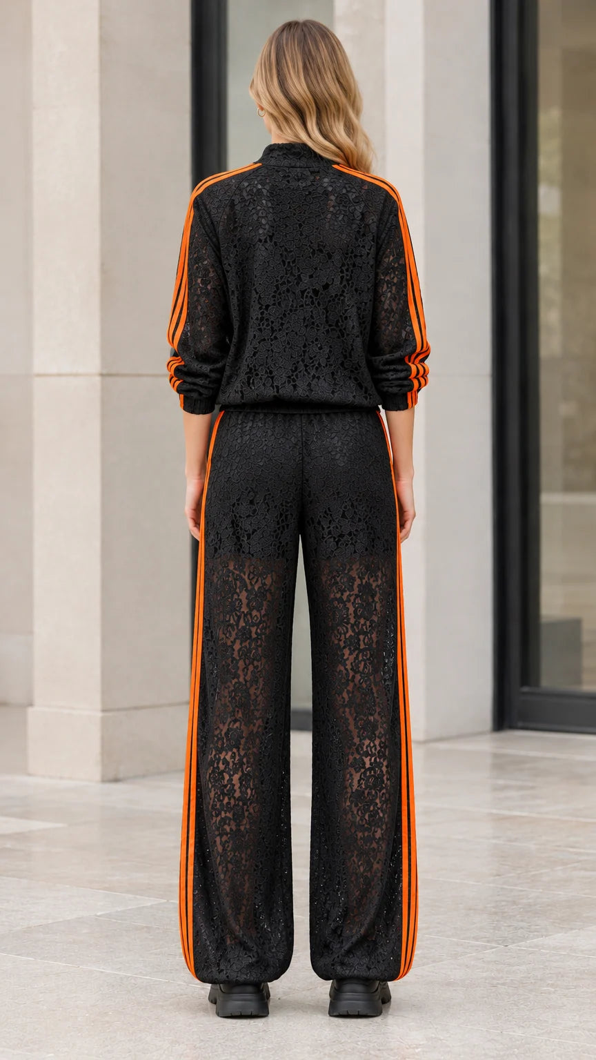 Back view of woman wearing black floral lace jacket and matching wide leg pants