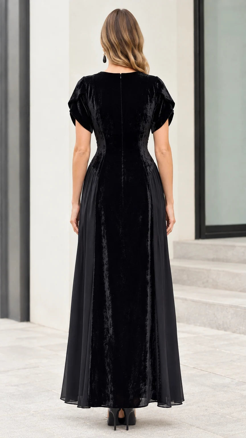Back view of model wearing black velvet maxi dress with concealed zipper