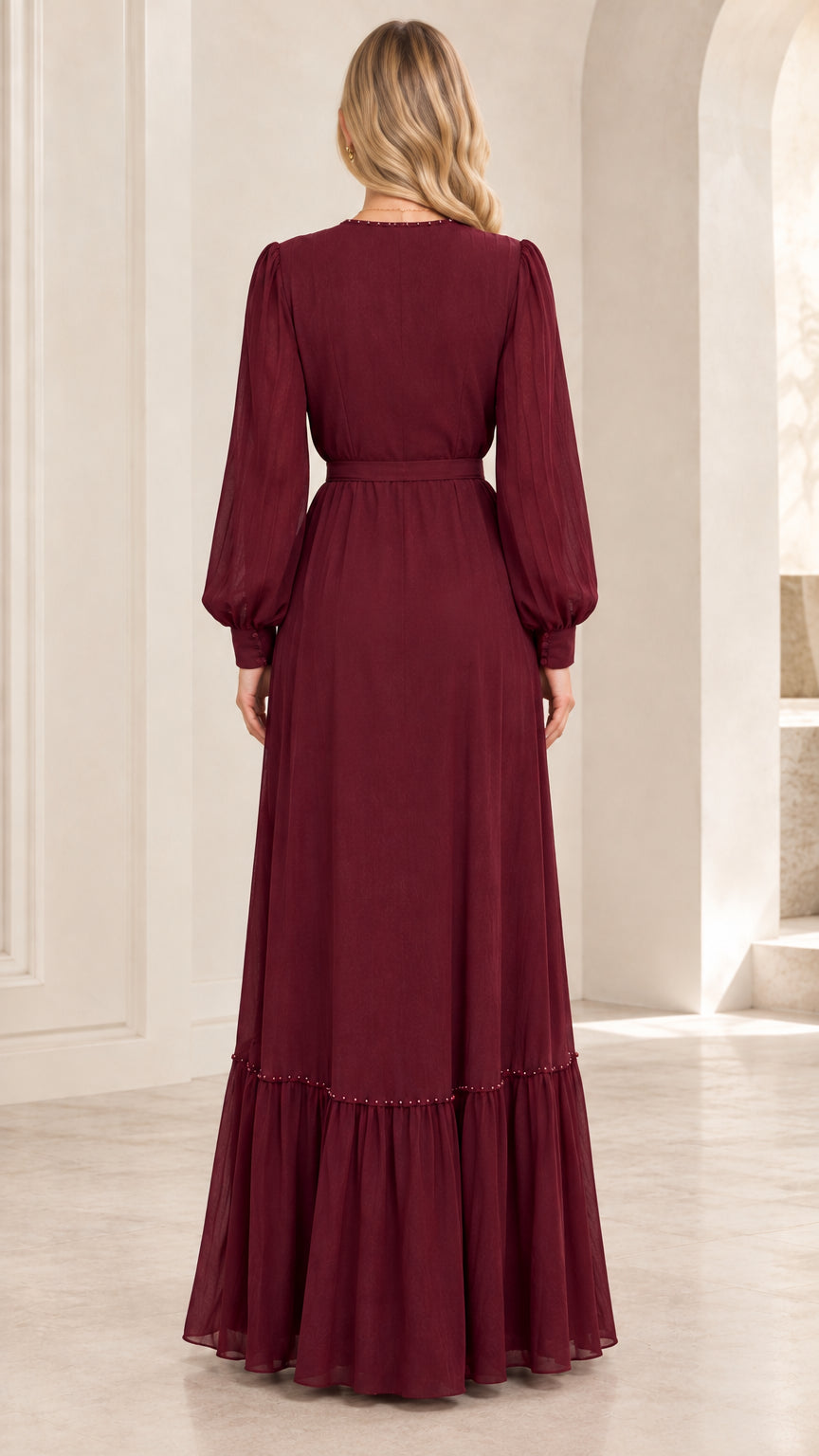 Back view of woman wearing burgundy long sleeve tiered maxi dress