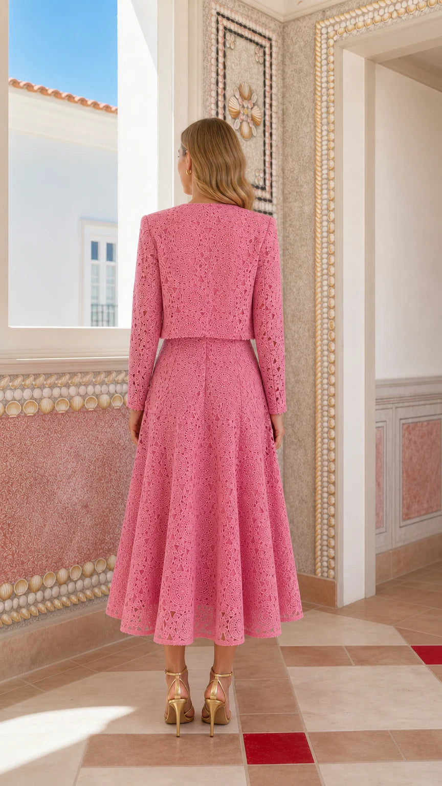 Back view of woman wearing pink lace crop jacket and midi dress