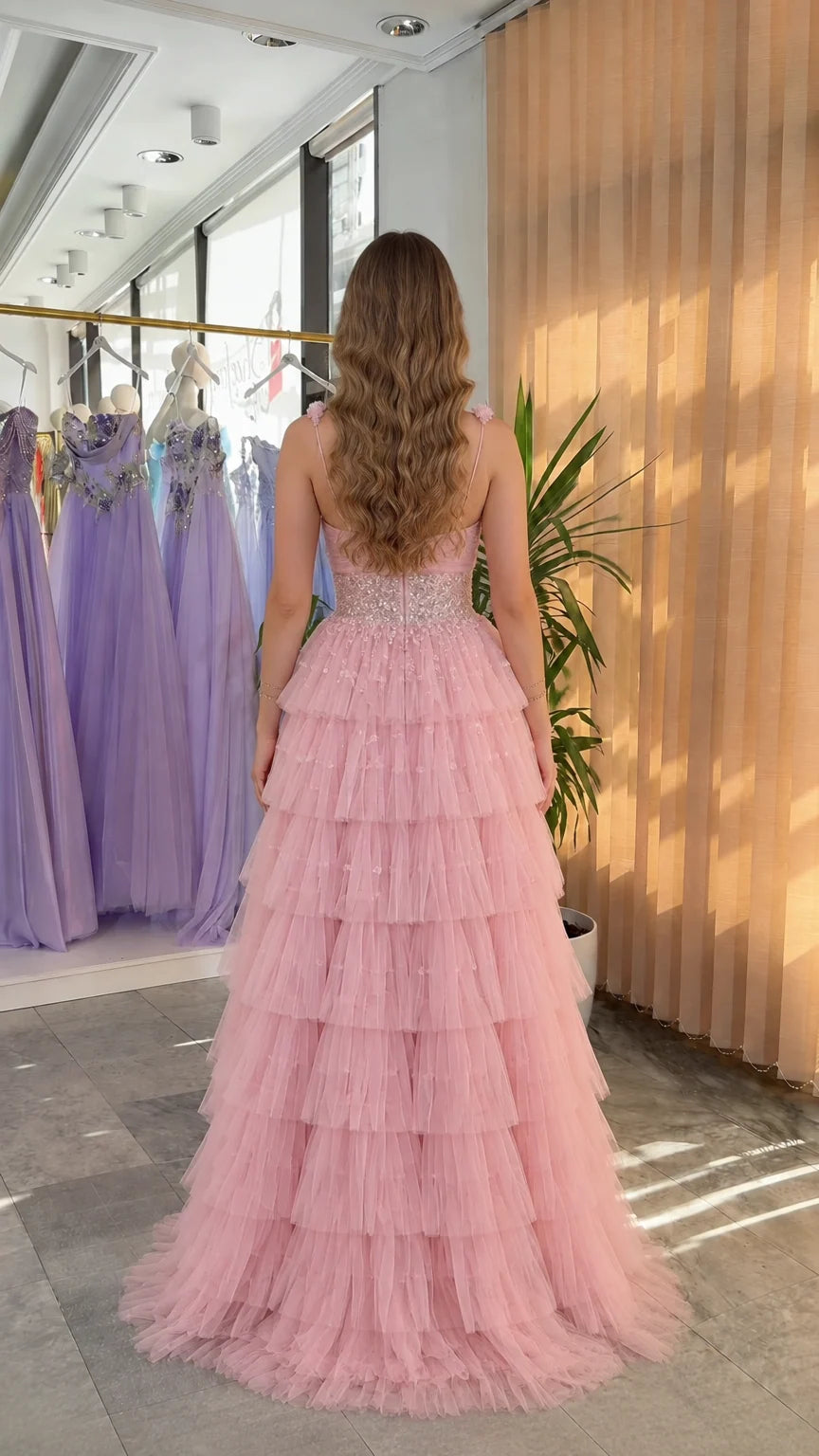 Back view of pink tiered ruffle tulle formal gown