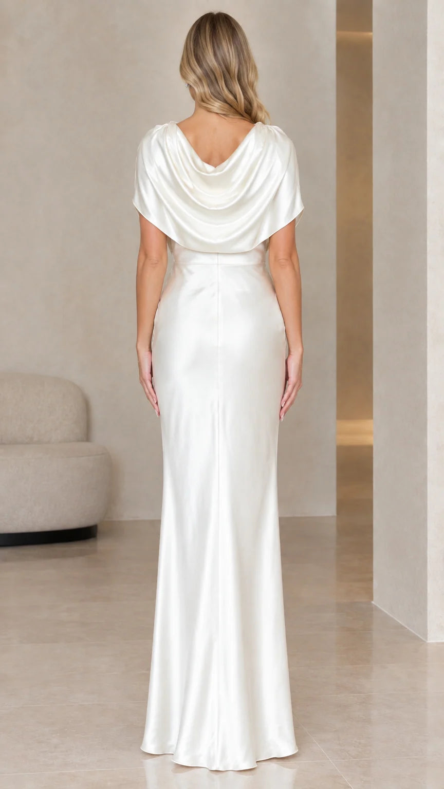 Back view of ivory satin evening dress showcasing draped cowl back design