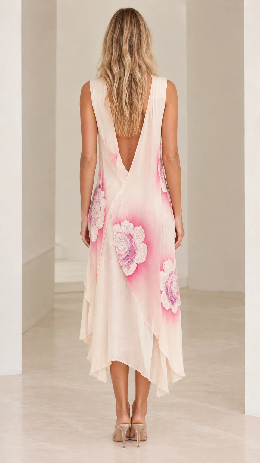 Back view of model showing low back detail on Blush Pink midi dress