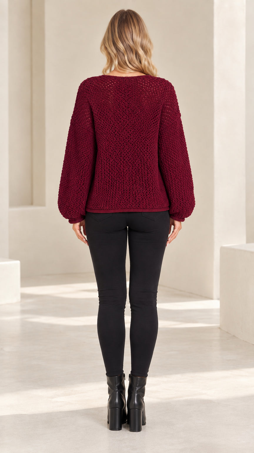 Back full-length view of burgundy textured knit crewneck cardigan sweater