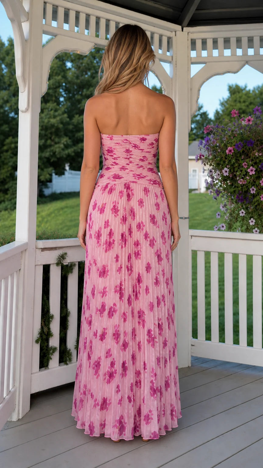 Back view of model in pink strapless pleated dress