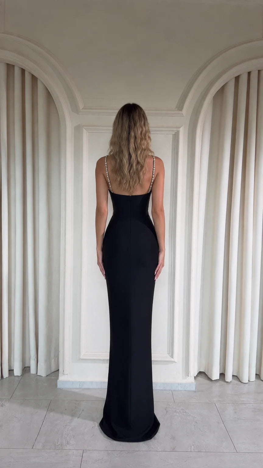 Black floor-length evening gown back view with delicate straps