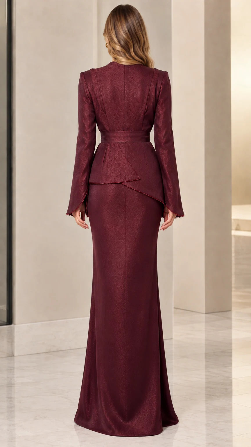 Back view of model in burgundy long sleeve floor-length gown showing back zipper line