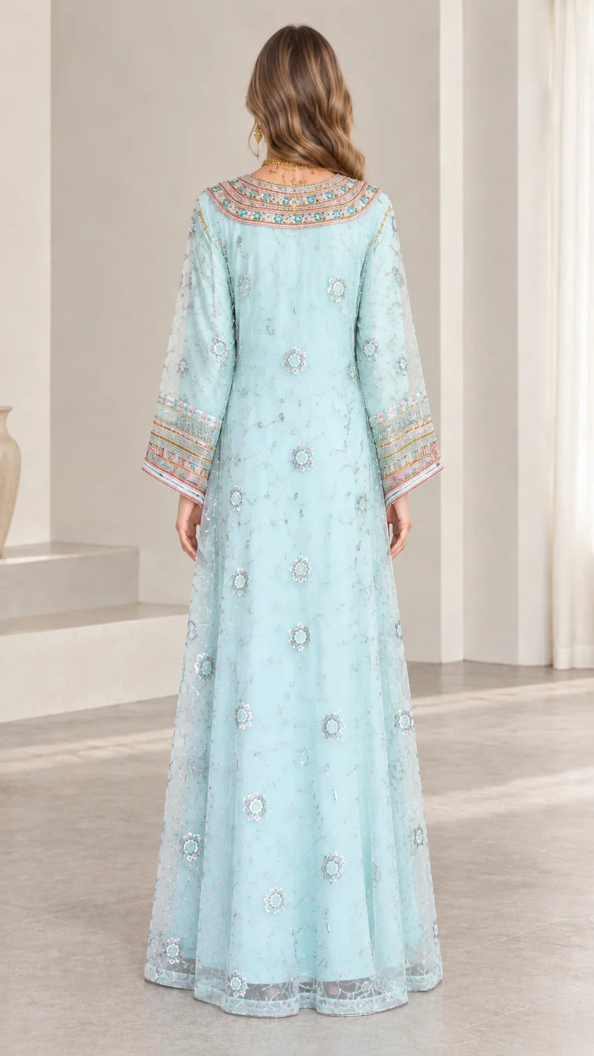 Back full-length view of woman wearing sky blue embroidered kaftan maxi dress