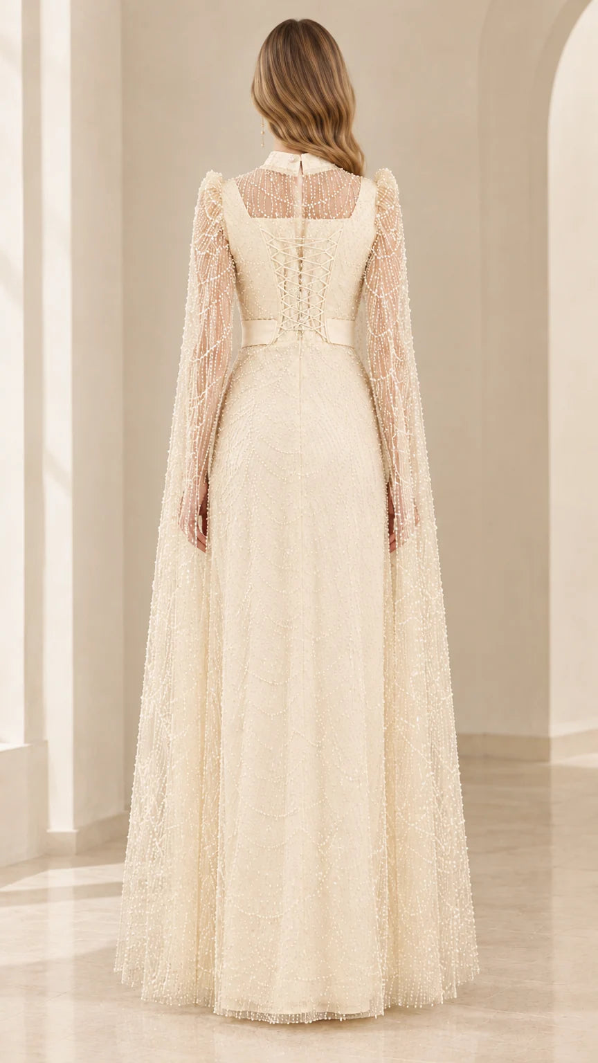 Back view of champagne embellished cape evening gown showing zipper detail