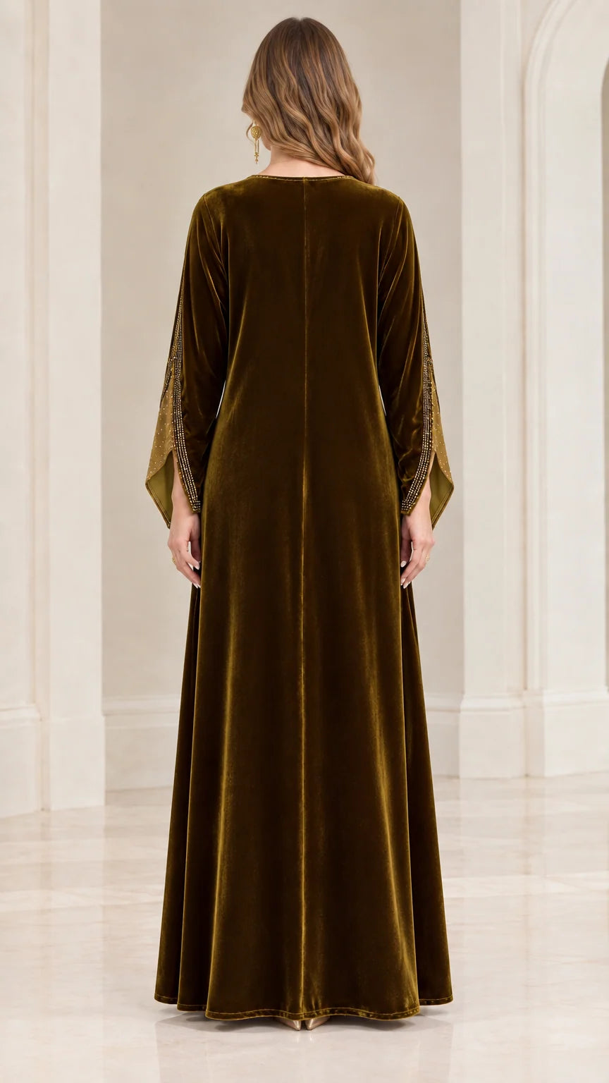 Back view of woman wearing full length olive green velvet kaftan dress