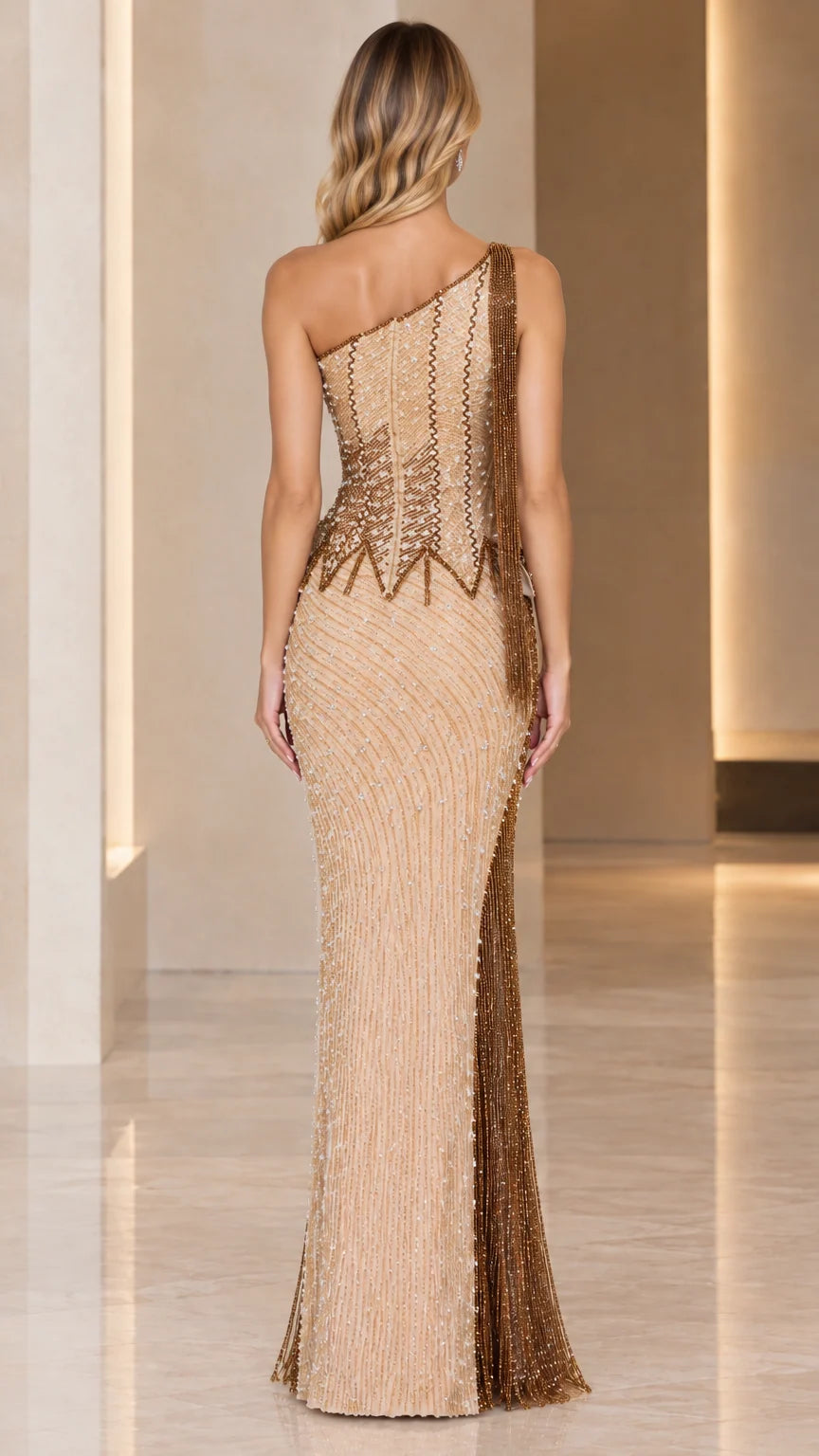 Back view of champagne gold one-shoulder embellished evening gown