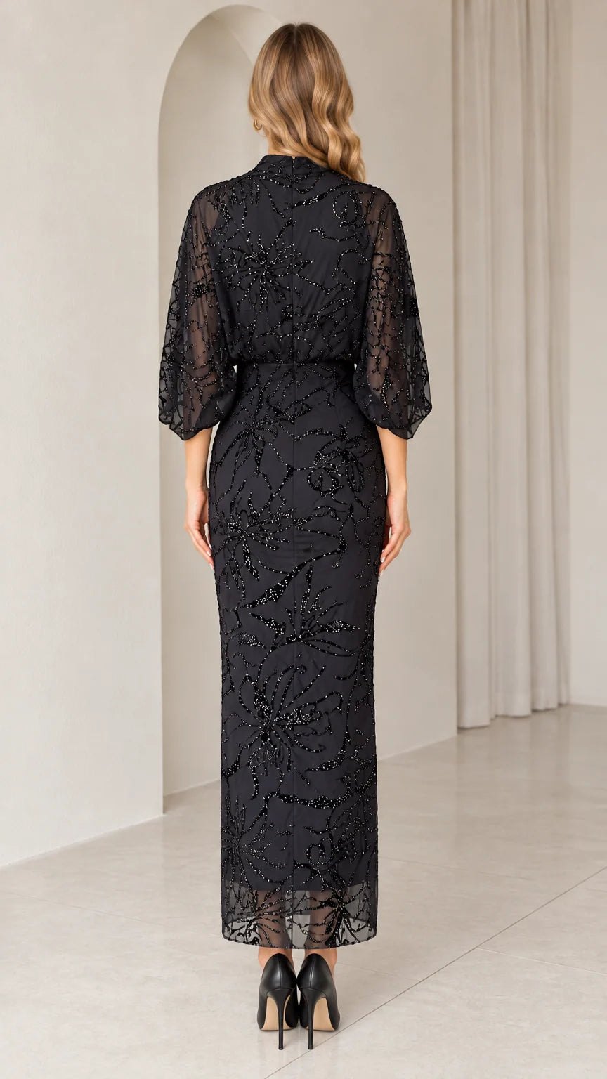 Back view of black high neck embellished evening gown