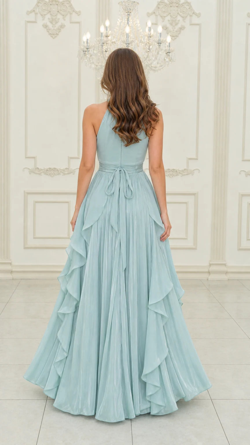Back view of light blue halter gown showing back silhouette and waist tie