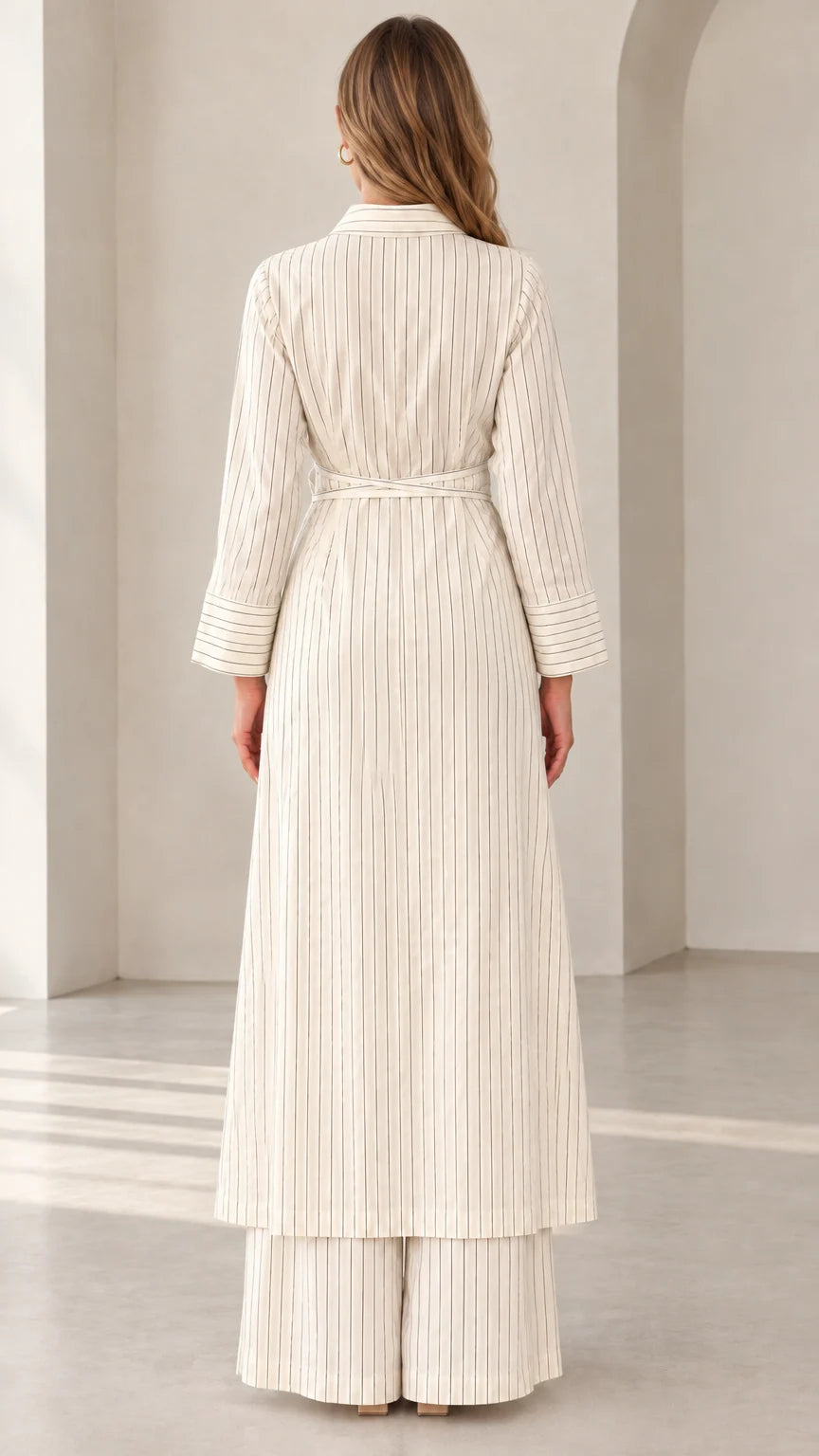 Back view of woman wearing Cream pinstripe maxi tunic and wide-leg pants