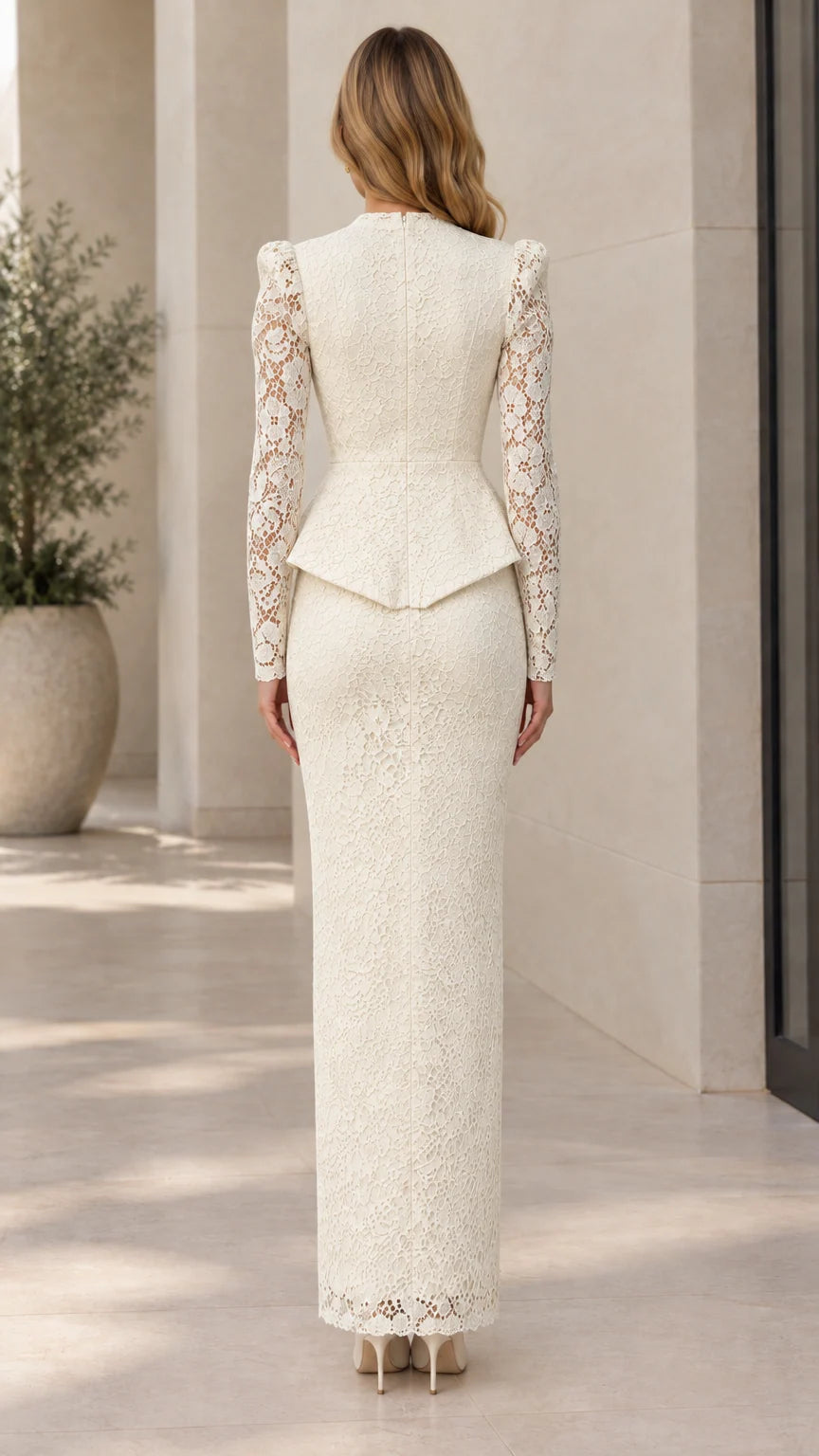 Back view of ivory floral lace peplum maxi gown showing tailored fit