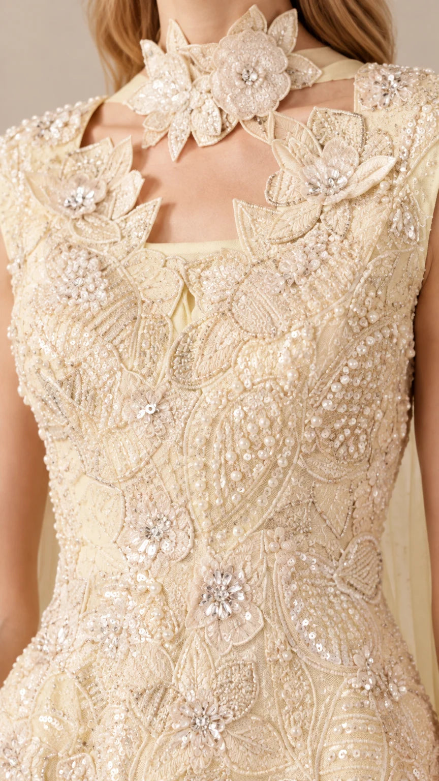 Close-up detail of 3D floral neckline and intricate beaded lace bodice in Champagne Yellow
