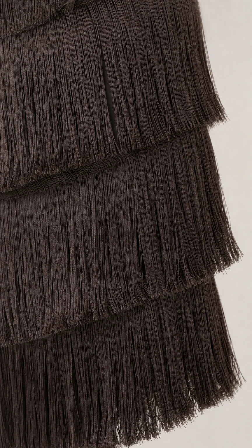 Close up detail of dark brown layered fringe texture