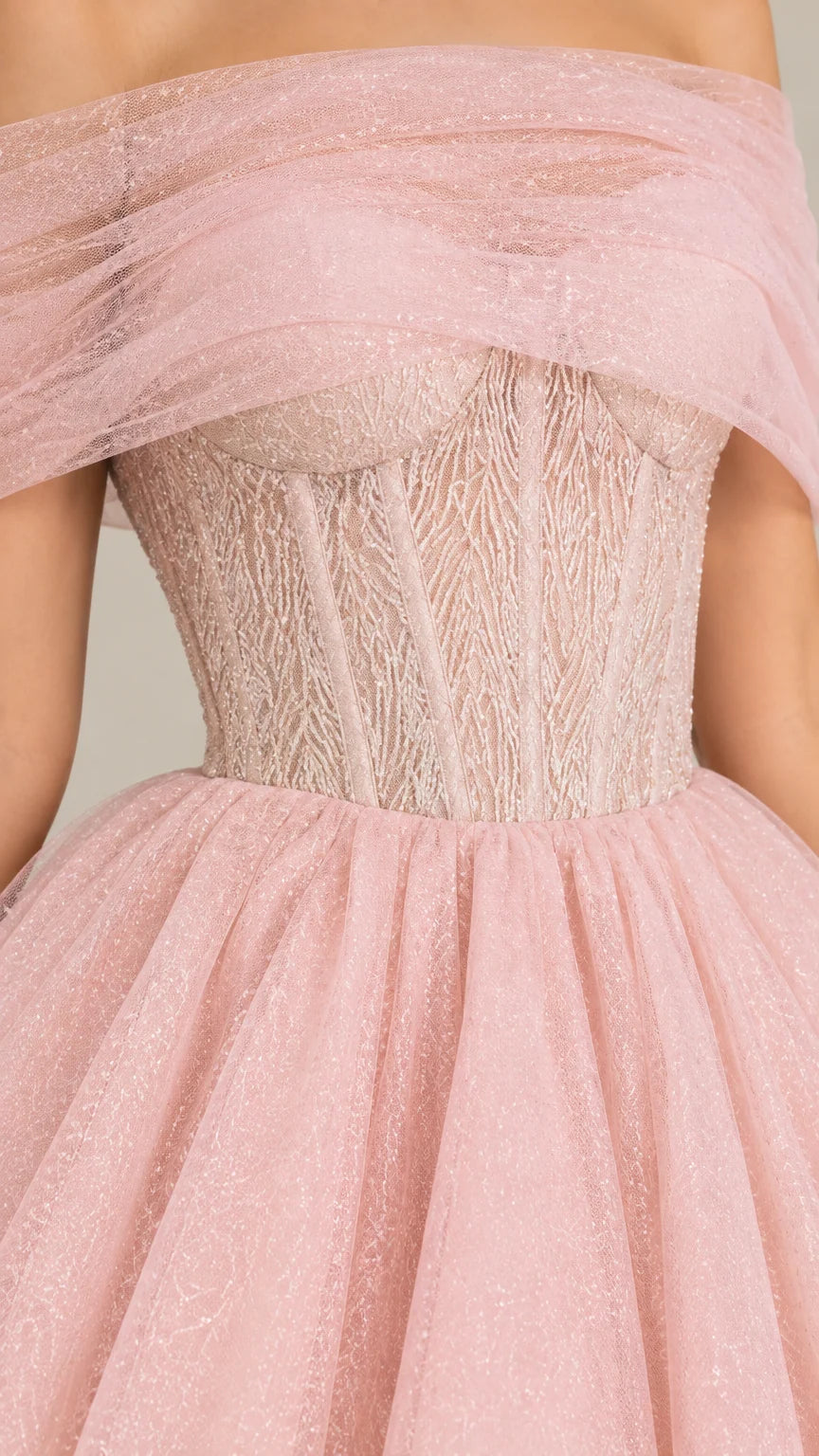 Close-up detail of textured boned corset bodice and draped tulle neckline