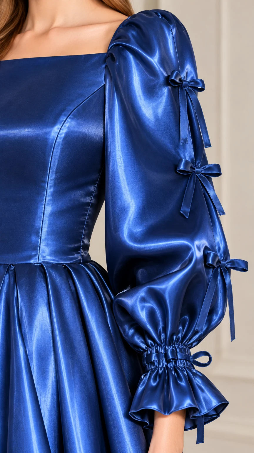 Close-up detail of Royal Blue satin bodice, square neckline, and bow-accented sleeve