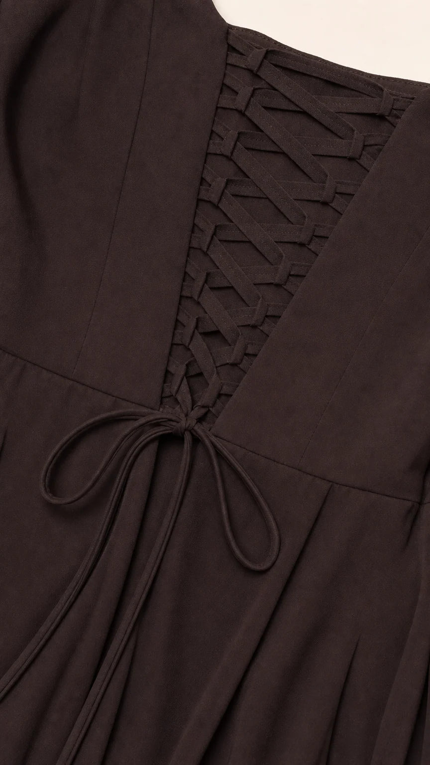 Close-up detail of the adjustable lace-up corset back on chocolate brown formal dress